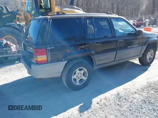 1996 Jeep Grand Cherokee Laredo with VIN 1J4GZ58S3TC345107, listed as a IAAI auction lot 41661884 with 179,175 mi miles. Bid and sale history available at carsss.com. Image 4.