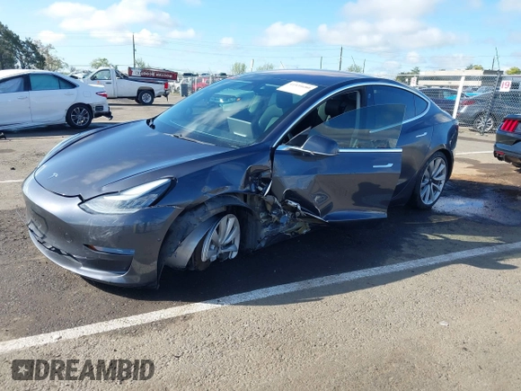 2018 Tesla Model 3 Long Range Battery with VIN 5YJ3E1EA4JF006036, listed as a IAAI auction lot 41934680 with 115,649 mi miles and . Bid and sale history available at DreamBid. Image 2.