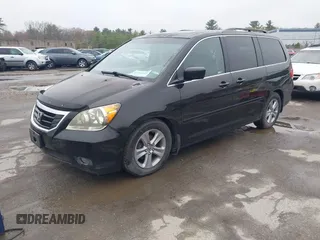 2010 Honda Odyssey Touring with VIN 5FNRL3H97AB056975, listed as a IAAI auction lot 42169269 with 183,483 mi miles. Bid and sale history available at carsss.com. Image 2.