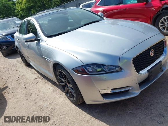 2016 Jaguar XJ R-Sport z VIN SAJWA1C7XG8W02813, wystawiony jako IAAI lot #42508758 z przebiegiem 102 919 mil mil oraz . Historia ofert i sprzedaży dostępna na DreamBid. Obrazek 1.
