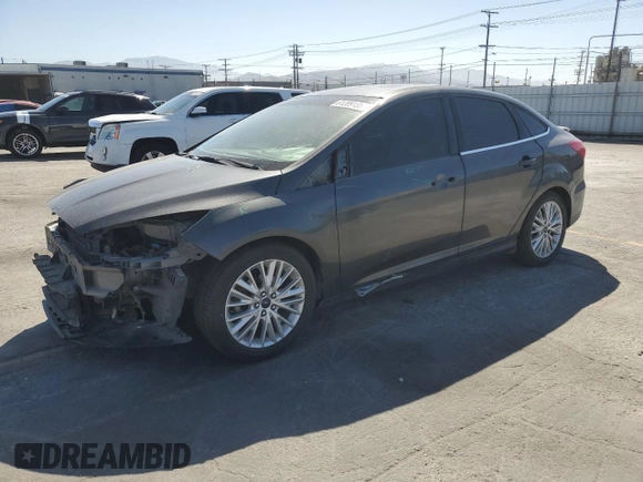 2017 Ford Focus Titanium with VIN 1FADP3J22HL279854, listed as a Copart auction lot 61209135 with 106,323 mi miles and Salvage title. Bid and sale history available at DreamBid. Image 1.
