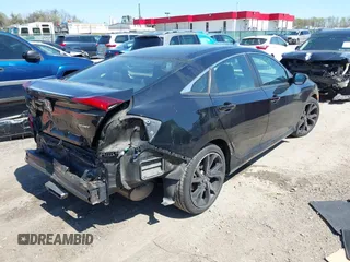 2019 Honda Civic Sport with VIN 2HGFC2F89KH569861, listed as a IAAI auction lot 41985114 with 104,880 mi miles and . Bid and sale history available at DreamBid. Image 4.