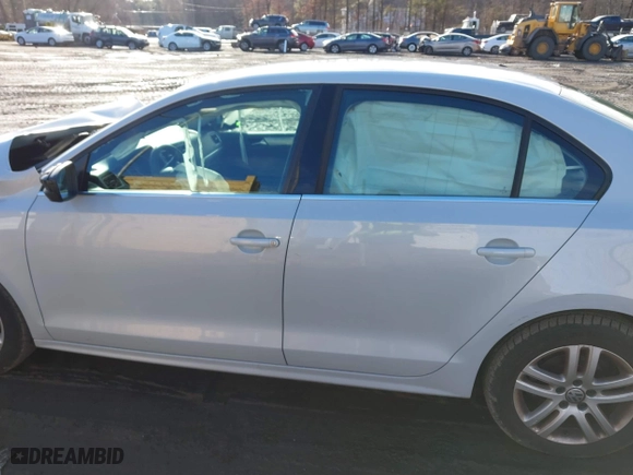 2017 Volkswagen Jetta 1.4T S with VIN 3VW167AJ9HM215563, listed as a IAAI auction lot 41473283 with 119,648 mi miles. Bid and sale history available at carsss.com. Image 14.