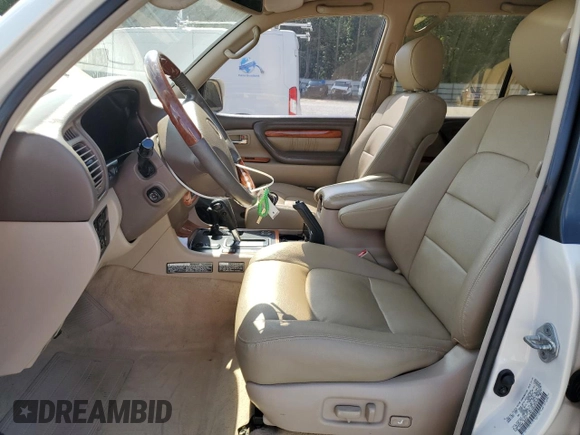 1999 Lexus LX 470 z VIN JT6HT00W1X0074382, wystawiony jako Copart lot #53612205 z przebiegiem 256 689 mil mil oraz Szkoda całkowita • Salvage title. Historia ofert i sprzedaży dostępna na DreamBid. Obrazek 7.