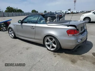 2010 BMW 1 Series 135i with VIN WBAUN9C55AVK41973, listed as a Copart auction lot 54609015 with 144,685 mi miles and Salvage Title. Bid and sale history available at carsss.com. Image 2.