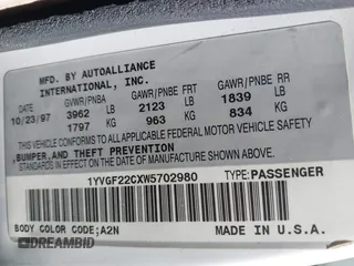 1998 Mazda 626 DX with VIN 1YVGF22CXW5702980, listed as a IAAI auction lot 41778063 with 104,672 mi miles. Bid and sale history available at carsss.com. Image 9.