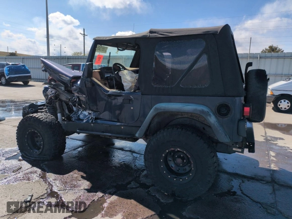 1997 Jeep Wrangler SE z VIN 1J4FY29P1VP441353, wystawiony jako Copart lot #51691545 z przebiegiem Nie podano mil oraz Szkoda całkowita • Salvage title. Historia ofert i sprzedaży dostępna na DreamBid. Obrazek 2.