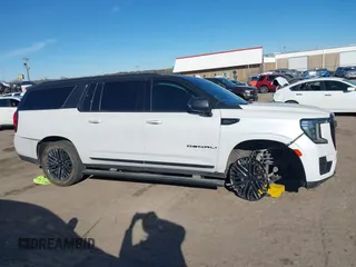 2021 GMC Yukon XL Denali with VIN 1GKS2JKT1MR401207, listed as a IAAI auction lot 41242619 with 87,902 mi miles and . Bid and sale history available at carsss.com. Image 13.
