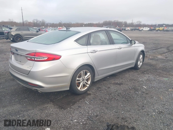 2018 Ford Fusion SE z VIN 3FA6P0HD2JR207865, wystawiony jako IAAI lot #41835895 z przebiegiem 91 069 mil mil oraz . Historia ofert i sprzedaży dostępna na DreamBid. Obrazek 4.
