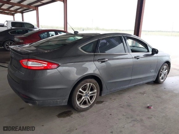 2016 Ford Fusion Energi Titanium with VIN 3FA6P0SU9GR103245, listed as a IAAI auction lot 41888435 with 123,975 mi miles. Bid and sale history available at carsss.com. Image 4.