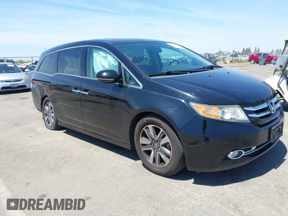 2014 Honda Odyssey Touring with VIN 5FNRL5H99EB133864, listed as a IAAI auction lot 42201359 with 122,490 mi miles and . Bid and sale history available at DreamBid. Image 1.