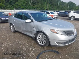 2014 Lincoln MKS z VIN 1LNHL9DK1EG602281, wystawiony jako IAAI lot #42474770 z przebiegiem 74 615 mil mil oraz . Historia ofert i sprzedaży dostępna na DreamBid. Obrazek 1.