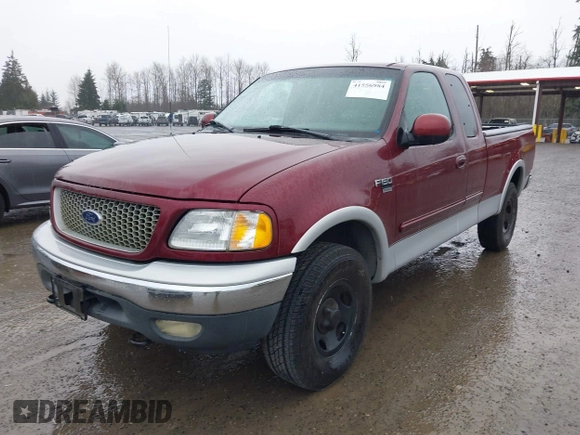 1999 Ford F-150 XL with VIN 2FTRX18L1XCA54790, listed as a IAAI auction lot 41556984 with 257,673 mi miles. Bid and sale history available at carsss.com. Image 2.