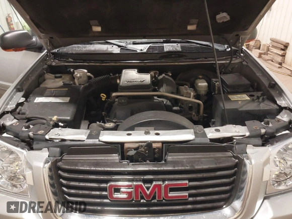 2004 GMC Envoy SLE with VIN 1GKDT13S042243883, listed as a IAAI auction lot 41795335 with 162,873 mi miles. Bid and sale history available at carsss.com. Image 10.