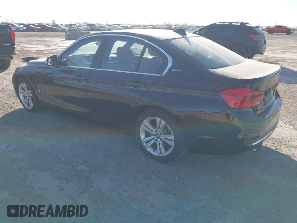 2017 BMW 3 Series 330e iPerformance with VIN WBA8E1C34HA156688, listed as a IAAI auction lot 41753490 with 74,130 mi miles. Bid and sale history available at carsss.com. Image 3.