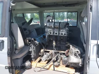2003 Volkswagen EuroVan MV with VIN WV2NB47003H003131, listed as a IAAI auction lot 42157821 with 166,159 mi miles and . Bid and sale history available at DreamBid. Image 8.