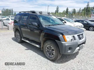 2015 Nissan Xterra Pro-4X z VIN 5N1AN0NW9FN658510, wystawiony jako IAAI lot #42482112 z przebiegiem 74 764 mil mil oraz . Historia ofert i sprzedaży dostępna na DreamBid. Obrazek 1.