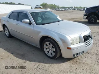2006 Chrysler 300 Touring with VIN 2C3KA53G26H459048, listed as a IAAI auction lot 42049103 with 256,564 mi miles. Bid and sale history available at carsss.com. Image 1.