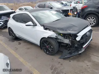 2019 Hyundai Veloster Turbo with VIN KMHTH6AB3KU020193, listed as a IAAI auction lot 41526722 with 54,697 mi miles. Bid and sale history available at carsss.com. Image 1.