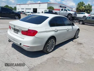 2014 BMW 3 Series 328i with VIN WBA3A5C54EP600398, listed as a IAAI auction lot 42665302 with 117,012 mi miles and . Bid and sale history available at DreamBid. Image 4.