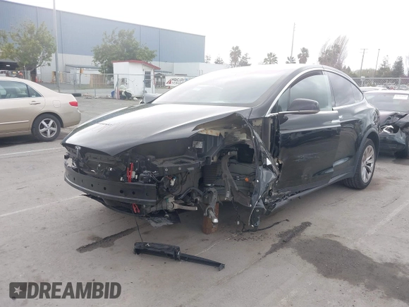 2017 Tesla Model X 90D with VIN 5YJXCAE2XHF075341, listed as a IAAI auction lot 41784008 with 77,439 mi miles and . Bid and sale history available at DreamBid. Image 6.