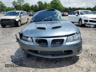 2005 Pontiac GTO z VIN 6G2VX12UX5L352121, wystawiony jako Copart lot #56840425 z przebiegiem 42 265 mil mil oraz Szkody całkowita. Historia ofert i sprzedaży dostępna na DreamBid. Obrazek 5.