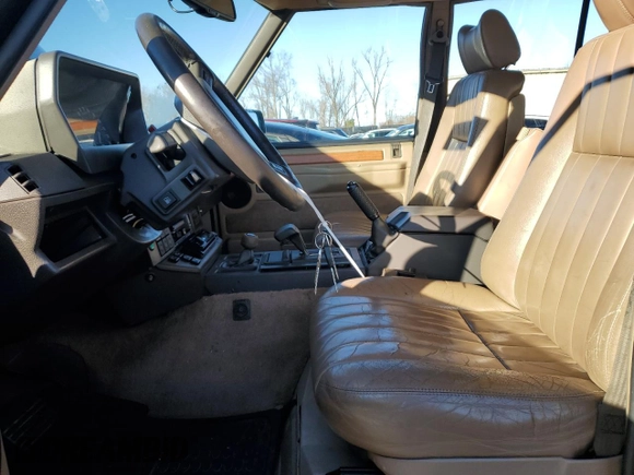 1994 Land Rover Range Rover with VIN SALHV1245RA640425, listed as a Copart auction lot 84764404 with 173,181 mi miles and Salvage Title. Bid and sale history available at DreamBid. Image 7.