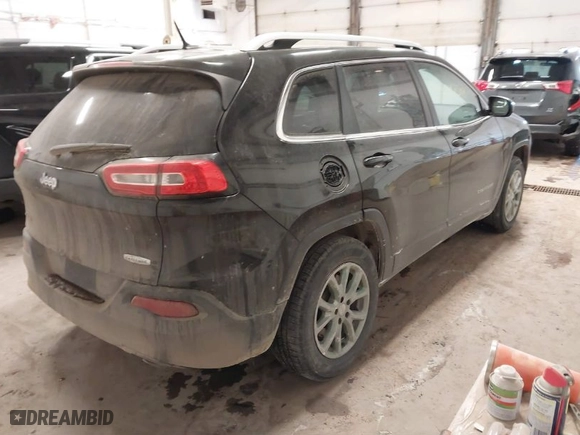 2014 Jeep Cherokee Latitude with VIN 1C4PJMCS0EW321380, listed as a IAAI auction lot 41597508 with 173,991 mi miles. Bid and sale history available at carsss.com. Image 4.