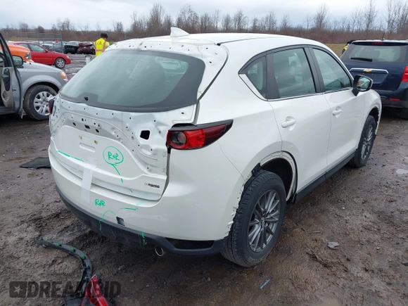 2019 Mazda CX-5 Sport with VIN JM3KFBBM2K0629966, listed as a IAAI auction lot 41953702 with 48,496 mi miles and . Bid and sale history available at DreamBid. Image 4.