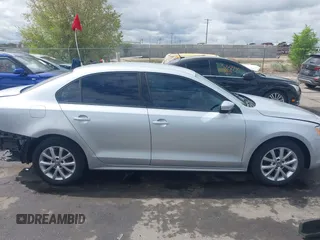 2011 Volkswagen Jetta SE z VIN 3VWDZ7AJ7BM340220, wystawiony jako IAAI lot #42136168 z przebiegiem 147 864 mil mil oraz . Historia ofert i sprzedaży dostępna na DreamBid. Obrazek 14.