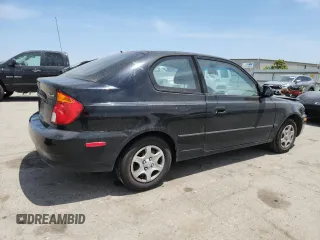 2003 Hyundai Accent GL z VIN KMHCG35C33U258812, wystawiony jako Copart lot #57509245 z przebiegiem 153 716 mil mil oraz Szkoda całkowita • Salvage title. Historia ofert i sprzedaży dostępna na DreamBid. Obrazek 3.