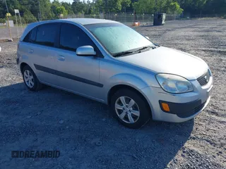 2009 Kia Rio LX with VIN KNADE243096440150, listed as a IAAI auction lot 42152589 with 114,484 mi miles. Bid and sale history available at carsss.com. Image 1.