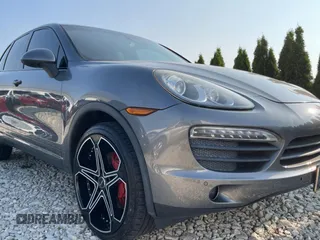 2011 Porsche Cayenne S with VIN WP1AB2A22BLA47332, listed as a Copart auction lot 65087385 with 112,033 mi miles and Salvage title. Bid and sale history available at DreamBid. Image 1.