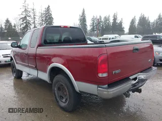 1999 Ford F-150 XL with VIN 2FTRX18L1XCA54790, listed as a IAAI auction lot 41556984 with 257,673 mi miles. Bid and sale history available at carsss.com. Image 3.