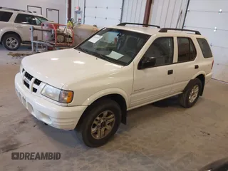 2004 Isuzu Rodeo S with VIN 4S2CK58W244313115, listed as a IAAI auction lot 42147475 with 186,594 mi miles and . Bid and sale history available at DreamBid. Image 2.