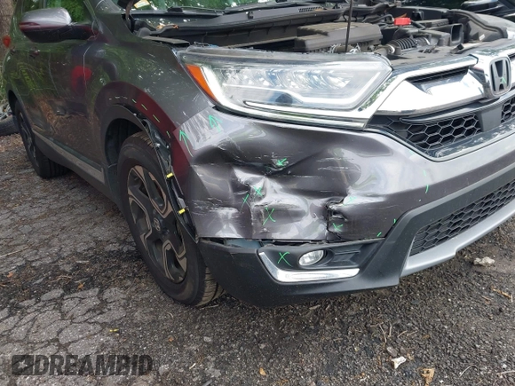 2018 Honda CR-V Touring z VIN 7FARW1H9XJE040530, wystawiony jako IAAI lot #42227446 z przebiegiem 101 299 mil mil oraz . Historia ofert i sprzedaży dostępna na DreamBid. Obrazek 6.