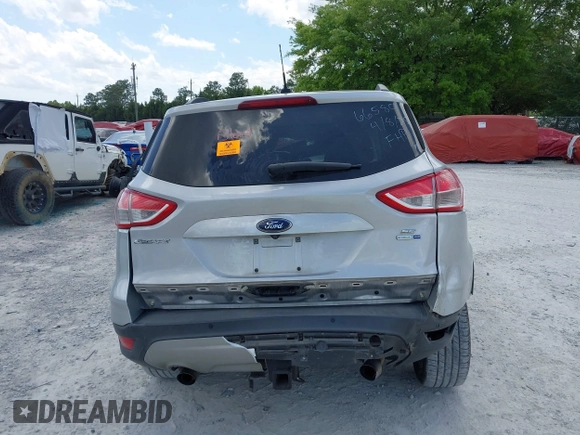 2016 Ford Escape SE with VIN 1FMCU9G92GUC28879, listed as a IAAI auction lot 42021065 with 99,184 mi miles. Bid and sale history available at carsss.com. Image 16.