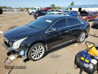 2013 Cadillac XTS Luxury z VIN 2G61P5S35D9172074, wystawiony jako Copart lot #71996124 z przebiegiem 122 338 mil mil oraz Szkody całkowita. Historia ofert i sprzedaży dostępna na DreamBid. Obrazek 1.