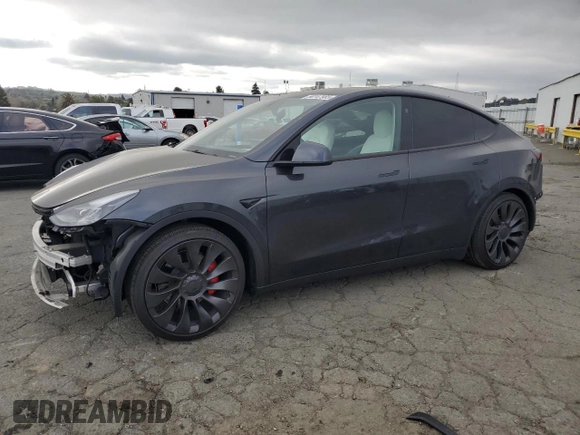 2024 Tesla Model Y Performance with VIN 7SAYGDEF7RF093054, listed as a Copart auction lot 50747985 with 26,907 mi miles and Salvage Title. Bid and sale history available at DreamBid. Image 1.