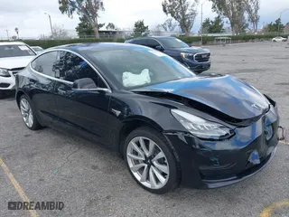 2018 Tesla Model 3 Long Range Battery with VIN 5YJ3E1EA9JF009384, listed as a IAAI auction lot 41544624 with 66,896 mi miles. Bid and sale history available at carsss.com. Image 1.