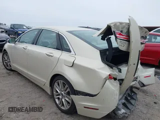 2014 Lincoln MKZ z VIN 3LN6L2GK4ER828656, wystawiony jako IAAI lot #41285297 z przebiegiem 102 513 mil mil oraz . Historia ofert i sprzedaży dostępna na DreamBid. Obrazek 3.