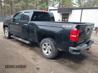 2014 Chevrolet Silverado 1500 LT with VIN 1GCVKREC4EZ110415, listed as a IAAI auction lot 41711383 with 100,344 mi miles and . Bid and sale history available at DreamBid. Image 3.
