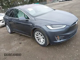 2020 Tesla Model X Long Range with VIN 5YJXCDE22LF304833, listed as a IAAI auction lot 41758853 with 77,428 mi miles. Bid and sale history available at carsss.com. Image 1.