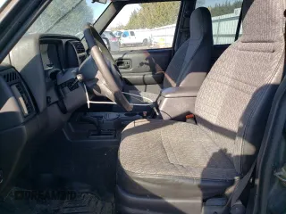 1999 Jeep Cherokee SE with VIN 1J4FF28S3XL551875, listed as a Copart auction lot 43057555 with 226,794 mi miles and Salvage title. Bid and sale history available at DreamBid. Image 7.