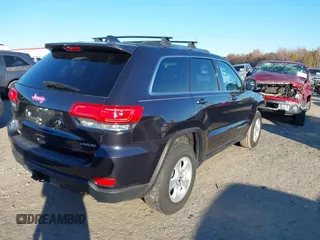 2014 Jeep Grand Cherokee Laredo with VIN 1C4RJEAG3EC218128, listed as a IAAI auction lot 40951611 with 119,596 mi miles and . Bid and sale history available at DreamBid. Image 4.
