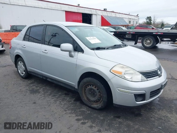 2007 Nissan Versa 1.8 SL with VIN 3N1BC11E97L447829, listed as a IAAI auction lot 41612386 with 123,500 mi miles. Bid and sale history available at carsss.com. Image 1.