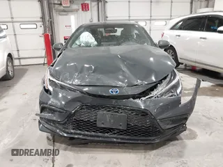 2023 Toyota Corolla Hybrid LE with VIN JTDBCMFE7P3021639, listed as a IAAI auction lot 41026783 with 38,656 mi miles. Bid and sale history available at carsss.com. Image 12.