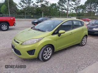 2011 Ford Fiesta SE with VIN 3FADP4EJXBM164397, listed as a IAAI auction lot 42046591 with 118,953 mi miles. Bid and sale history available at carsss.com. Image 2.