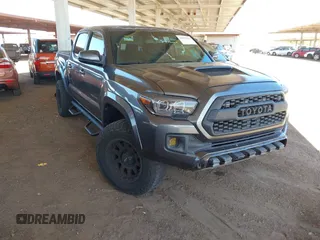 2016 Toyota Tacoma SR with VIN 3TMCZ5AN3GM041689, listed as a IAAI auction lot 42577623 with 212,009 mi miles and . Bid and sale history available at DreamBid. Image 1.