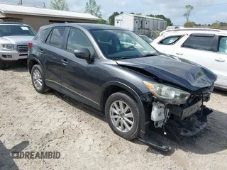 2016 Mazda CX-5 Touring with VIN JM3KE2CYXG0647921, listed as a IAAI auction lot 41948068 with 133,733 mi miles and . Bid and sale history available at carsss.com. Image 1.